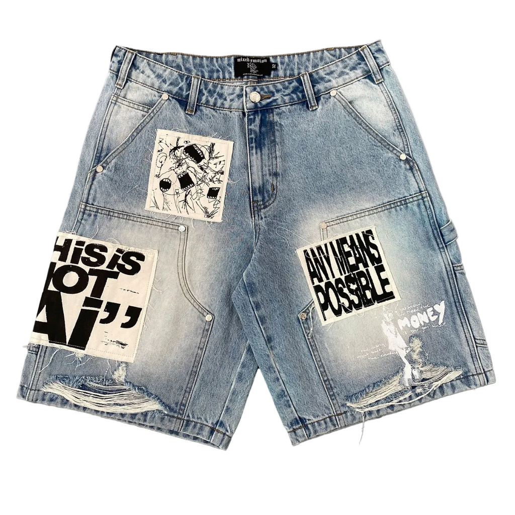 Light blue denim shorts with distressed fading, frayed hems, and multiple graphic patches on the front, including one with the text 'THIS IS NOT AI' and another with 'ANY MEANS POSSIBLE'.