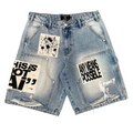 Light blue denim shorts with distressed fading, frayed hems, and multiple graphic patches on the front, including one with the text 'THIS IS NOT AI' and another with 'ANY MEANS POSSIBLE'.